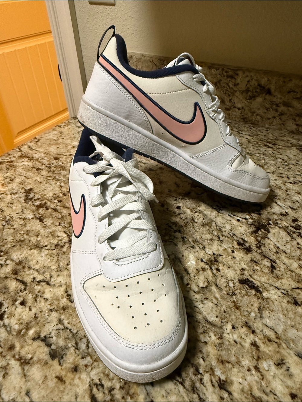 Nike Kids White Sneakers with Pink Swoosh and Navy Accents